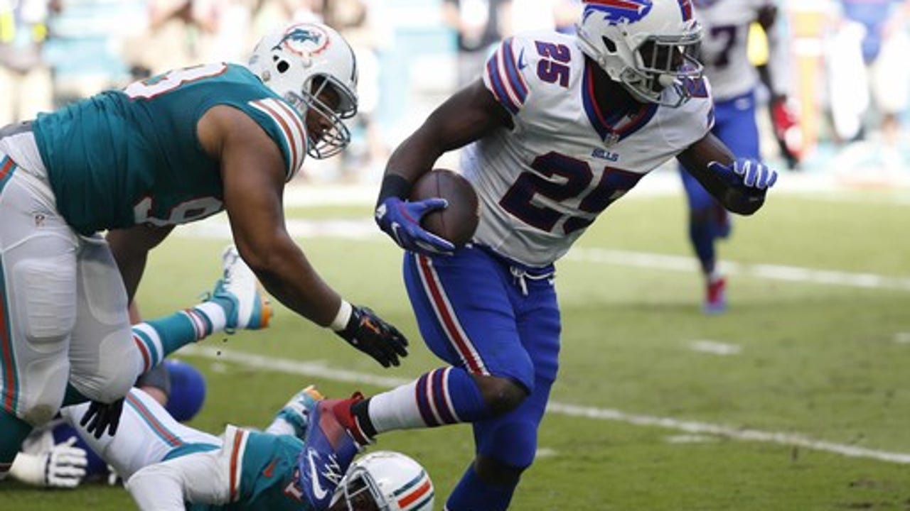 The Latest: Chargers DT Reid carted off with knee injury